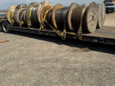 Cable spools loaded on a flatbed trailer