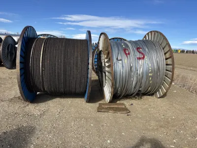 Copper wire scrap spools staged at a loading dock